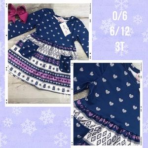 Girls Nordic design aline long sleeve dress in blues, white and purple.